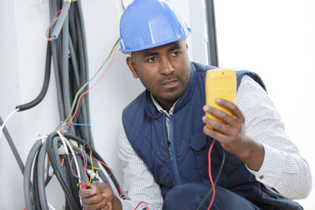 man holding a multimeterの写真素材