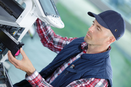 a technician inspecting the cartridge