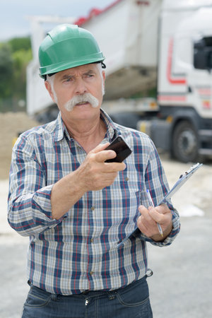 man architect outdoor of a construction siteの写真素材