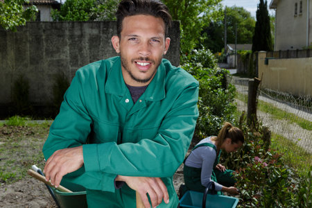 young smiling gardener in gardenの写真素材