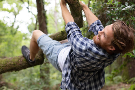 happy man going up a tree