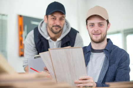 apprentice and mentor smiling at camera