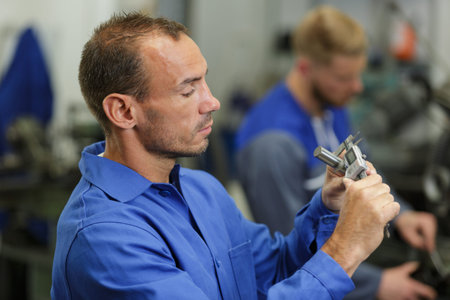 a mechanic mending apart