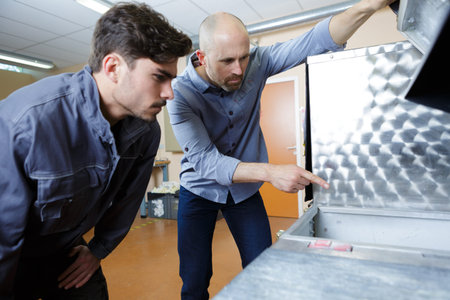 an apprentice fixing an object