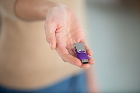 flash drives in woman hand