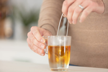 close-up of male hand holding mug