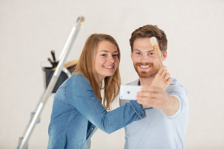 creative young couple renovating their houseの写真素材