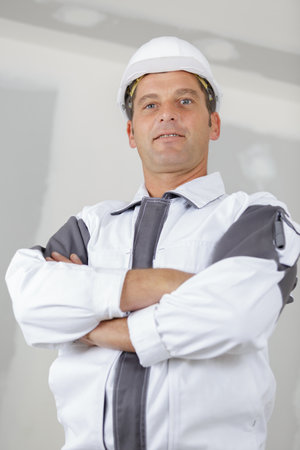 portrait of a middle-aged tradesman in uniformの写真素材