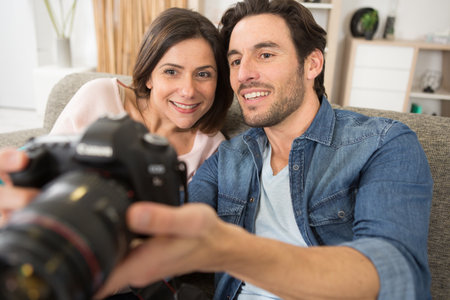 two young friends use their cameraの写真素材