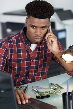 computer engineer repairing broken desktopの写真素材