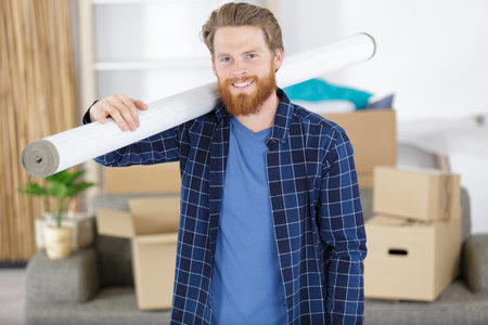 man is carrying a wallpaperの写真素材