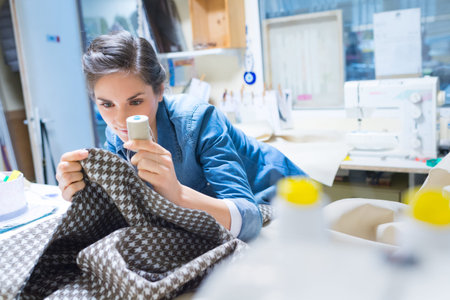 woman sewing hand at studio