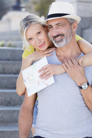 happy mature couple hugging outdoorsの写真素材