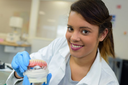 artificial denture technician posing