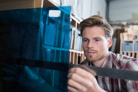 man working in a glass worksop