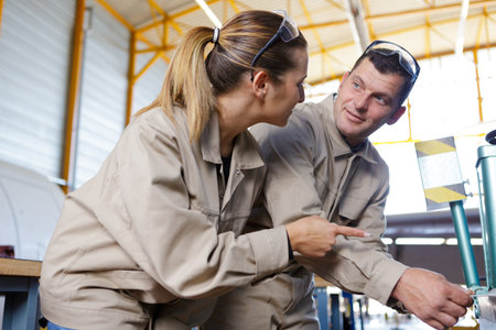 two mechanics discussing list of worksの写真素材