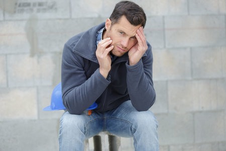 a tired engineer is outdoors