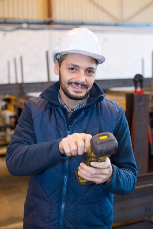 man scanning by handheld device