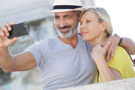 senior couple taking selfieの写真素材