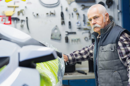 elderly worker in the garage