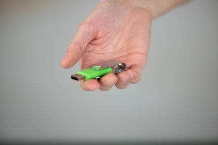 pen drive or usb stick in hand or memory drive