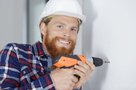 smiling handyman excited about starting a new job