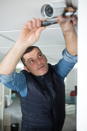 worker is ready to install the cctv camera