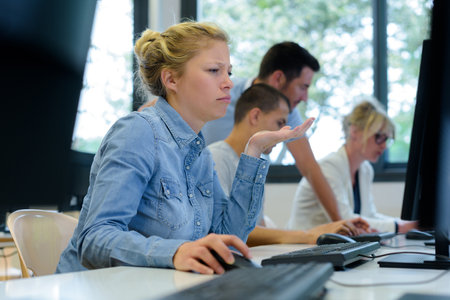 female computer student having difficulty with subjectの写真素材