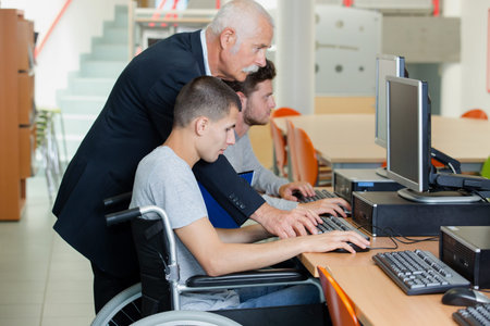 boy in wheelchair in class