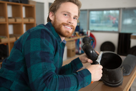 engineer using pliers in his workshop
