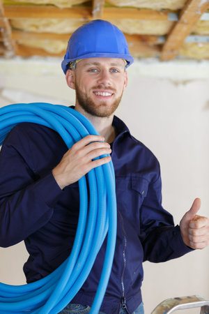 happy plumber showing thumb up