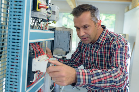 computer repairman working on repairing network in it workshopの写真素材