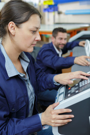 man and woman mechanics at work