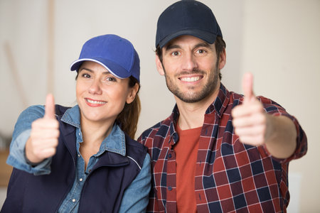 builder architect engineer as friendly team giving thumb upの写真素材