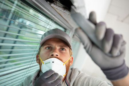 young builder at construction siteの写真素材