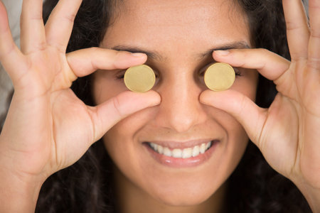 coins on the eyes as symbol of love money