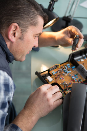 electronics technician at work