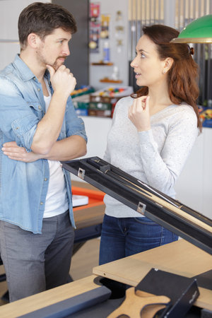 young couple at a snooker pool store