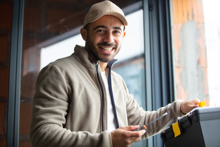 portrait of builder on site with toolsの写真素材
