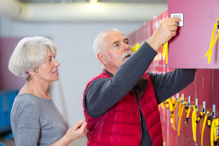 senior people having in the locker roomの写真素材