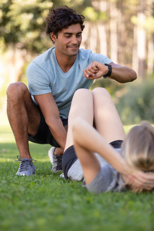 smiling caucasian couple exercising in morningの写真素材