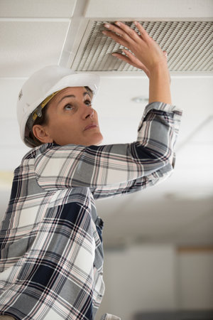 female pushing a clean air filterの写真素材