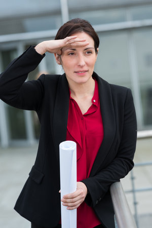 professional woman looking if her meeting is readyの写真素材