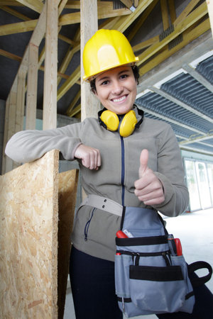 woman builder shows thumb upの写真素材