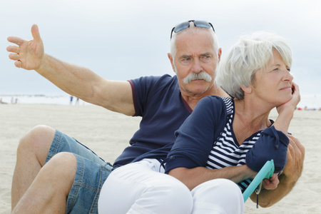 senior couple arguing with each other at the beachの写真素材