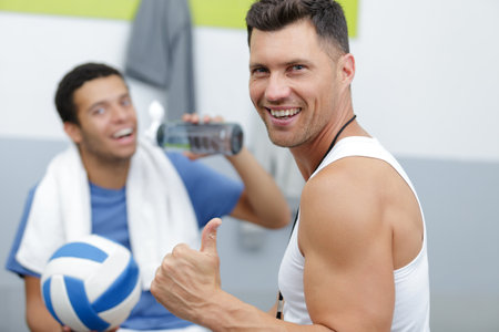 smiling man showing thumbs upの写真素材