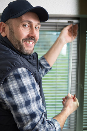 builder works on window blindsの写真素材