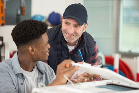 apprentice and manager laughing about subject
