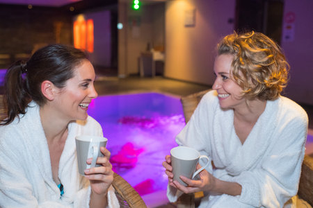 2 females relaxing saunaの写真素材