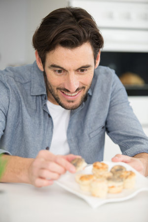 a man preparing tapas for friends